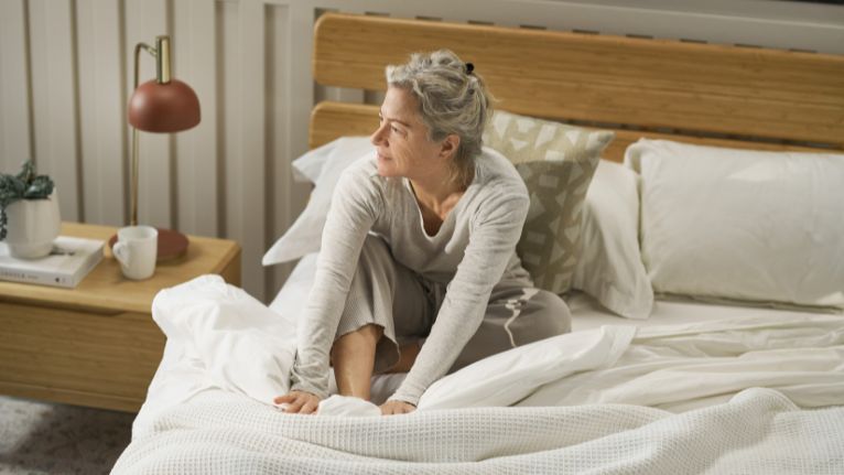 Woman sitting on the bed