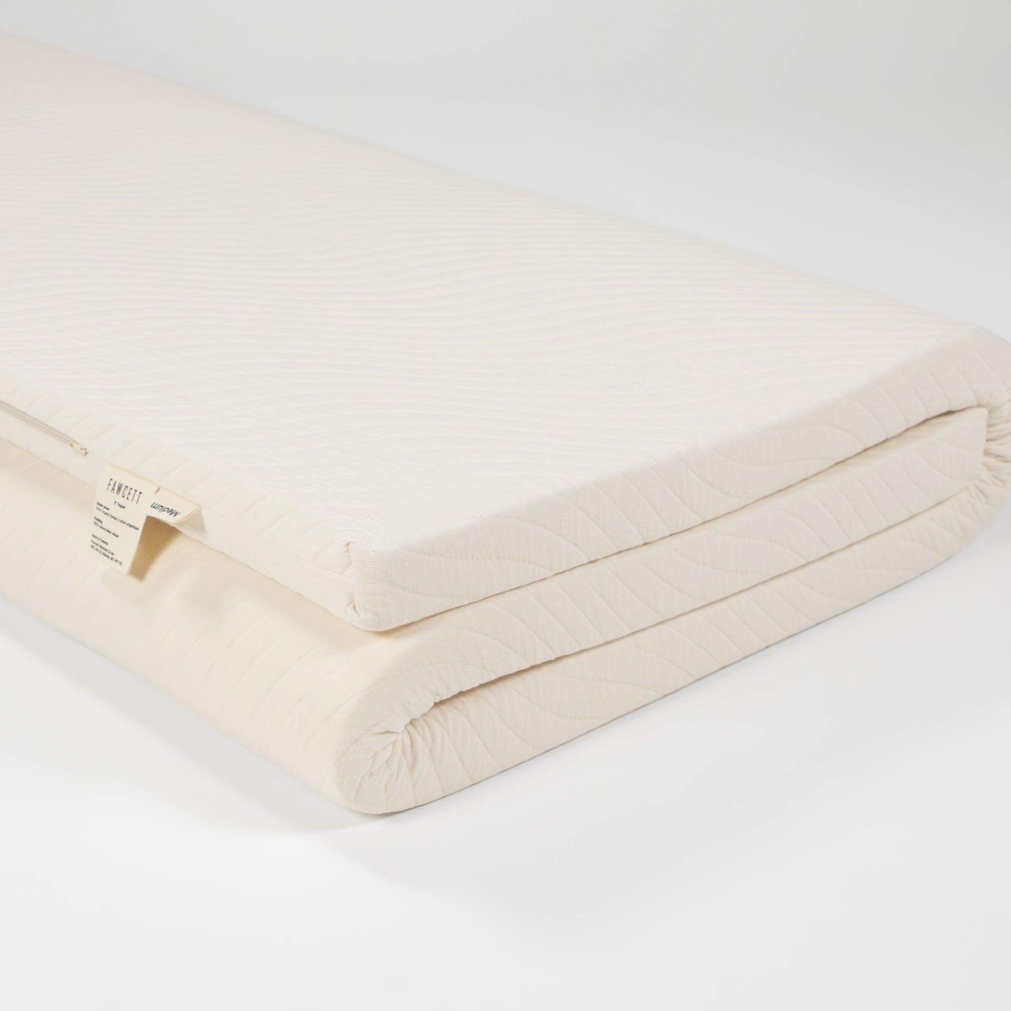 2 inch natural latex topper folded up side view