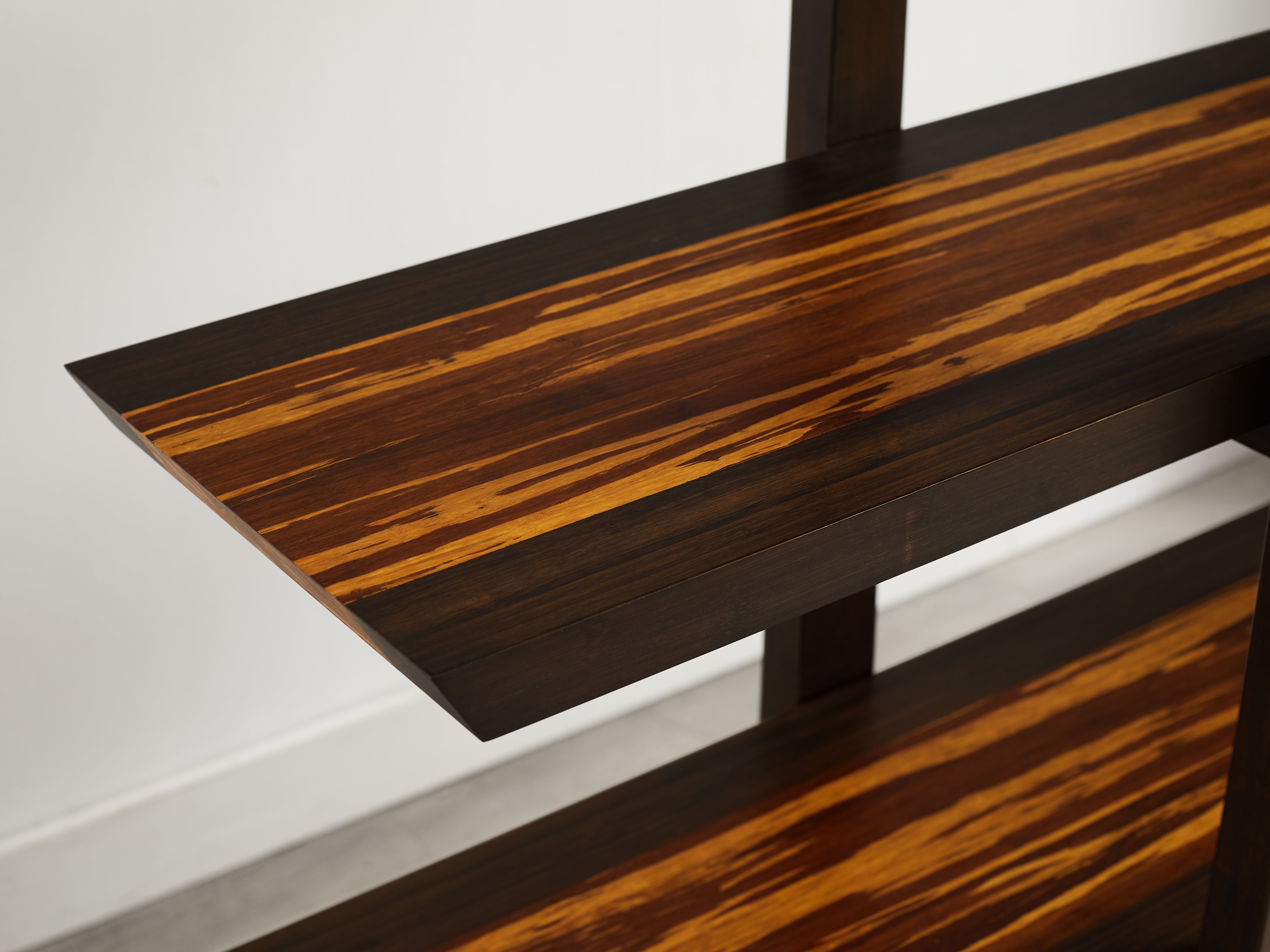 Wooden surface of book case with a dark brown and white pattern on a white background
